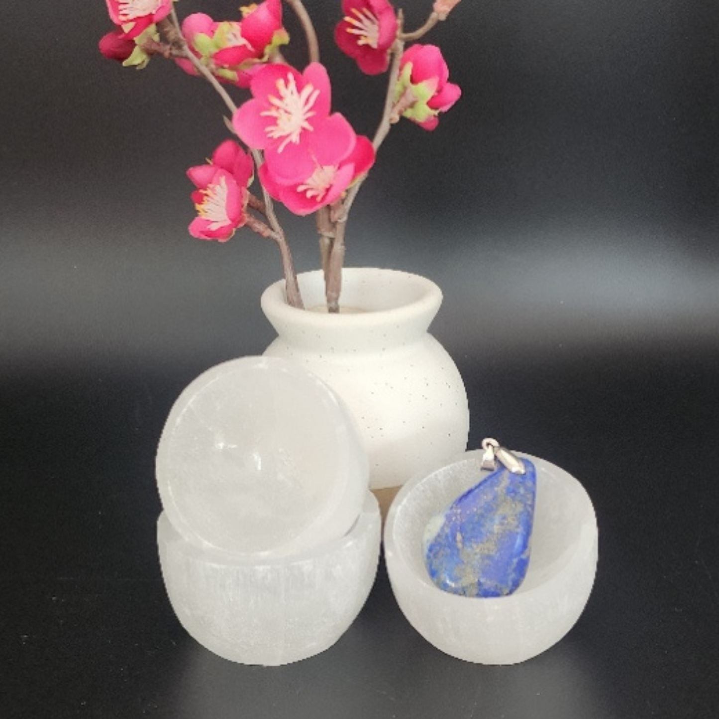 three small selenite bowls set in a Bloom and Glow moody aesthetic.