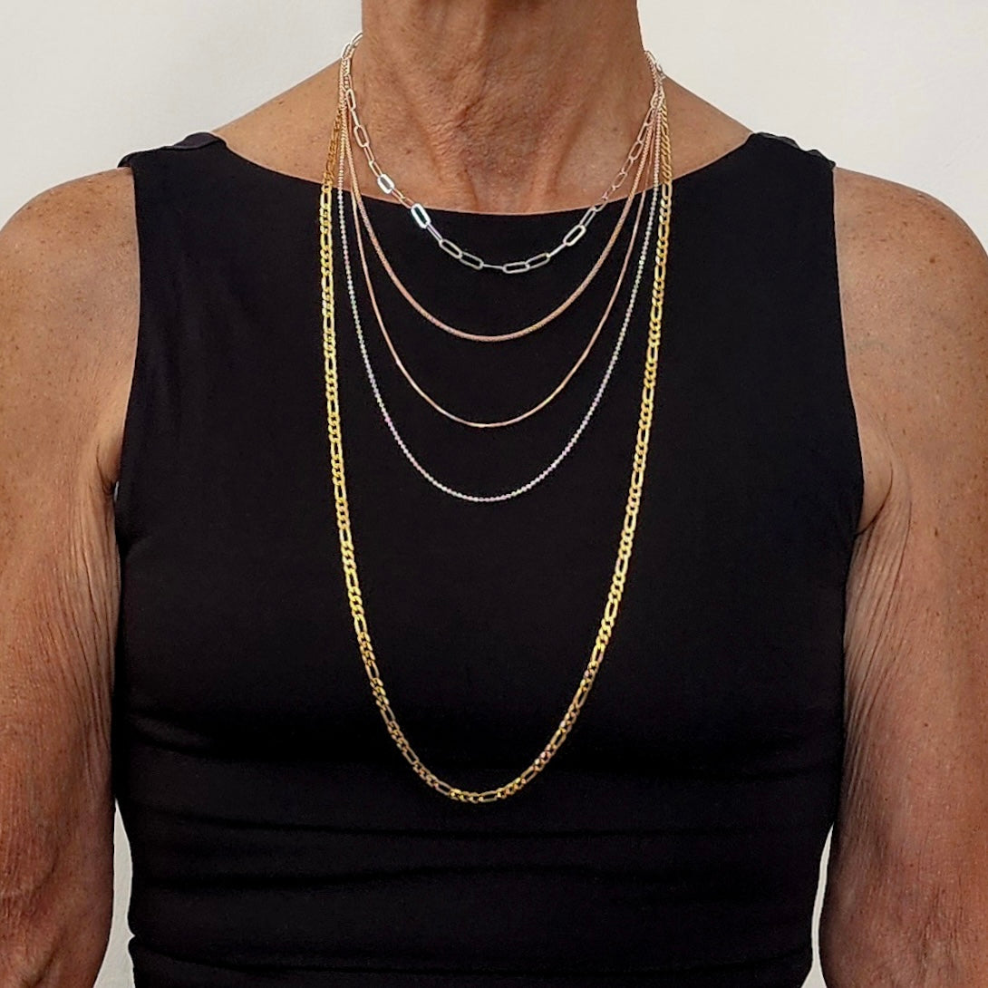 woman, size small, wearing chains in five lengths and five different styles to show where they fall. 