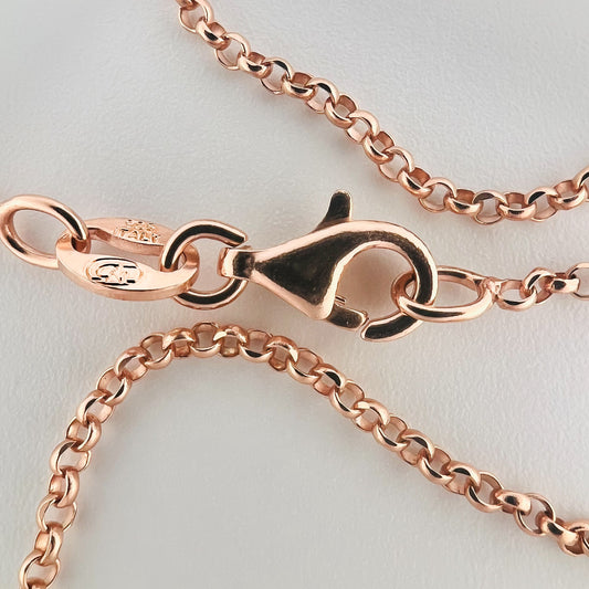 close up of closure on rose gold chain with 925 silver stamp and clear pattern of rolo style chain are visible